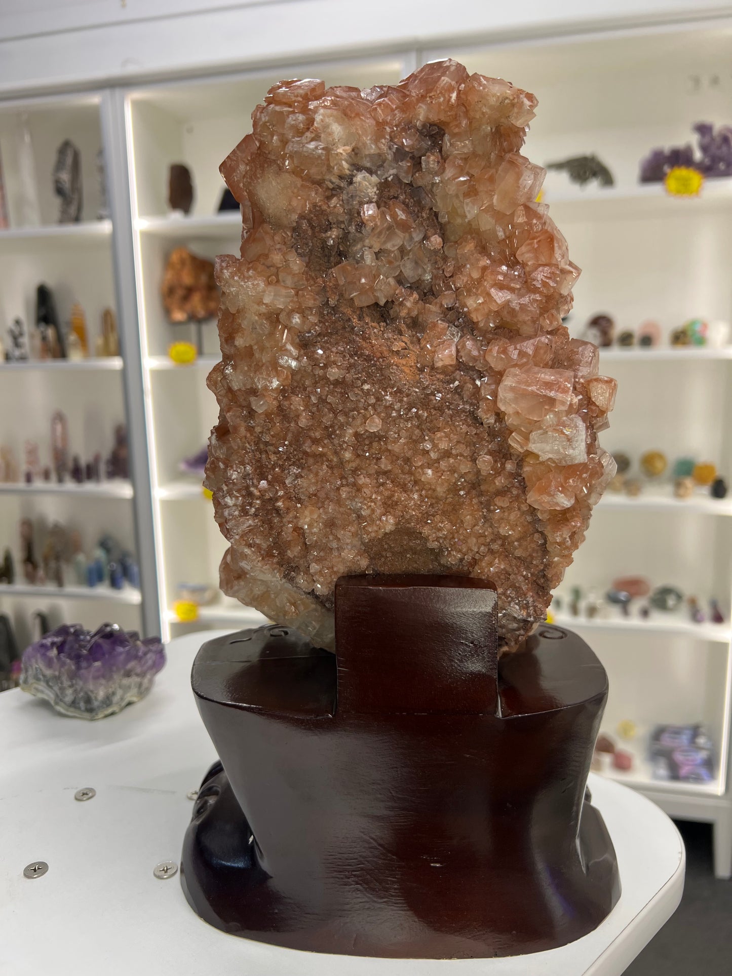 Red Calcite Cluster on Wooden Stand