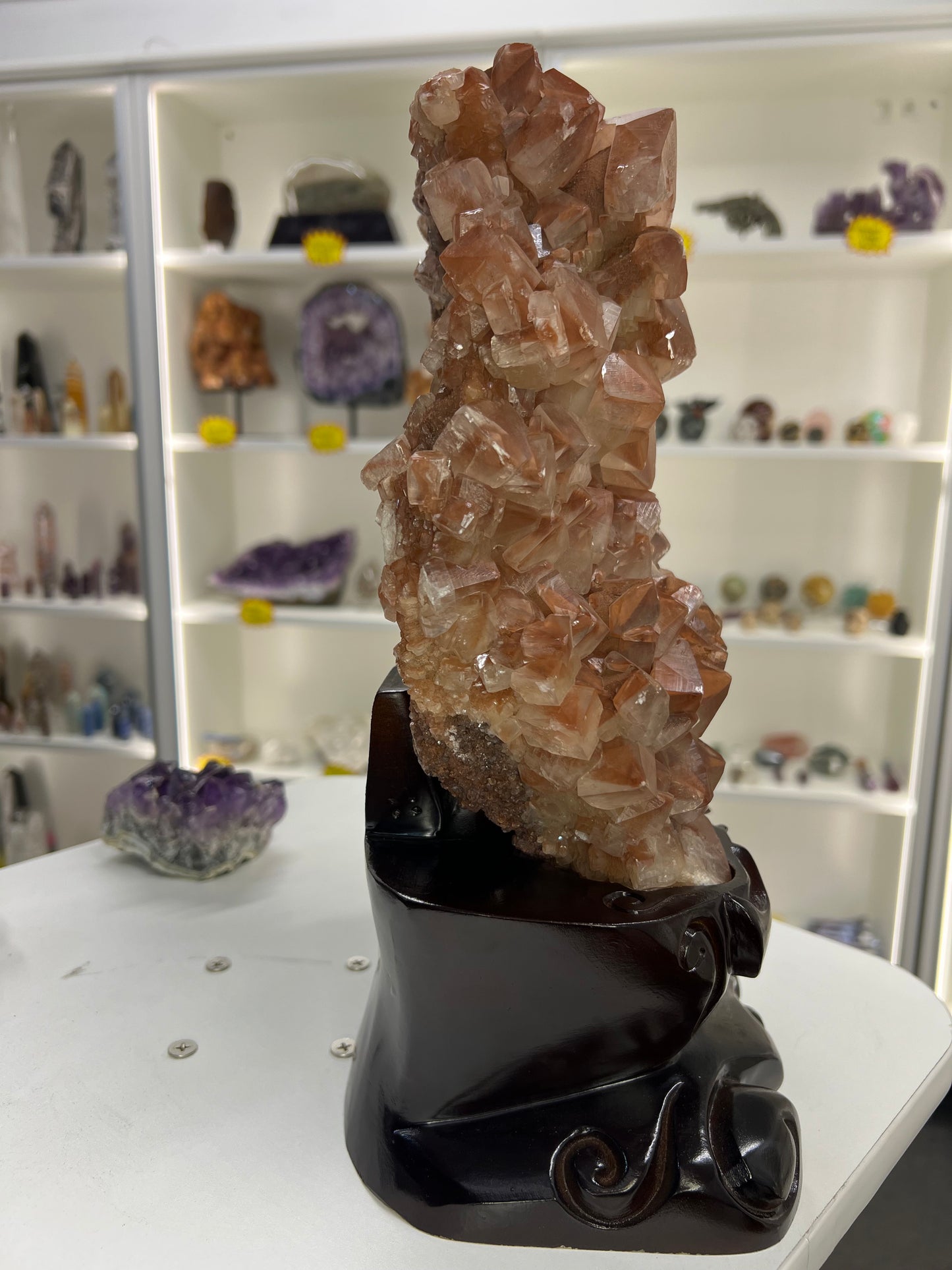 Red Calcite Cluster on Wooden Stand