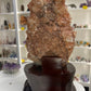 Red Calcite Cluster on Wooden Stand