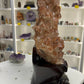 Red Calcite Cluster on Wooden Stand