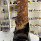 Red Calcite Cluster on Wooden Stand